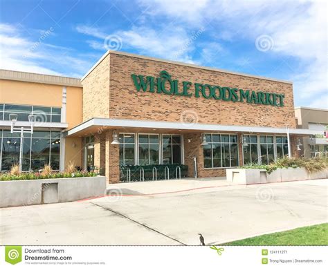 Close Up Logo Of Whole Foods Market At Store Entrance Facade Editorial