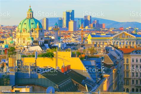 Karlskirche And Modern Financial District Above Vienna Cityscape With