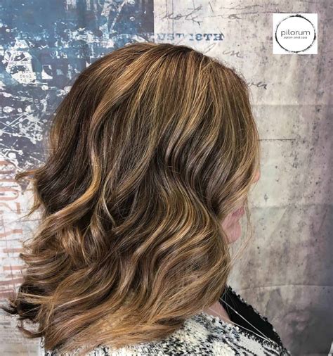 These applied highlights work great if your hair is naturally dark brown. Brown Hair with Blonde Highlights | Pilorum Salon & Spa