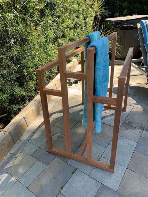 Here are awesome pool storage ideas to keep it organized! Grand XL Outdoor Wooden Pool Towel Rack and Pool Float Storage | Etsy in 2020 | Pool towels ...