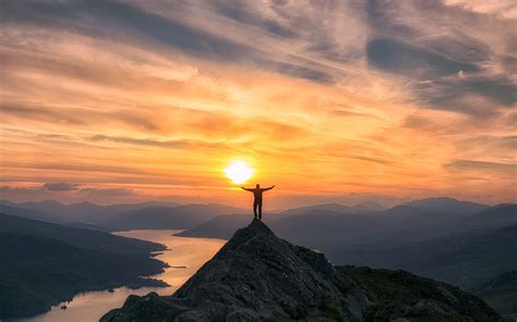 Photo Of Man On Top Of Mountain During Sunset Hd Wallpaper