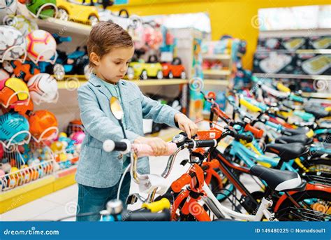 Little Boy Buying Bicycle In Kids Store Side View Stock Image Image