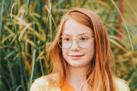 Portrait Of Adorable Red Haired Girl Wearing Glasses Stock Image