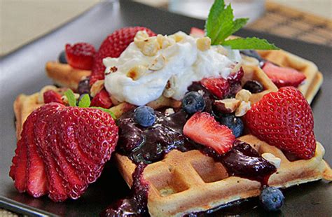 Brunch Week Waffles With Berry Compote Creme Fraiche And Hazelnuts