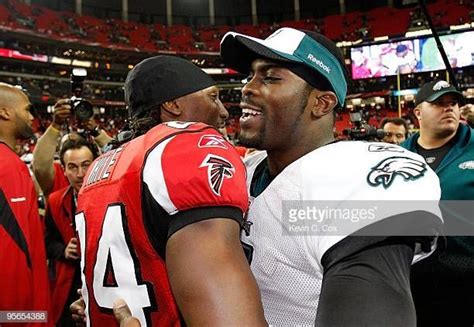 Michael Vick Of The Philadelphia Eagles Against Roddy White Of The