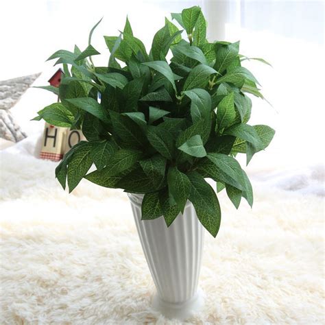 Decorating the home interiors with plants gives it such an attractive look that no one can resist themselves to praise the beauty of your home. Simulation 7 Branches Real Touch Bay Leaf Artificial ...