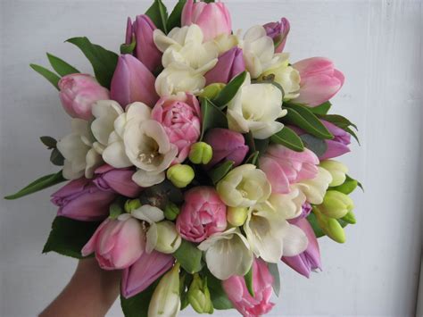 Tulip bouquets send an arrangement of tulip flowers for delivery. a sweet wedding bouquet of scented white freesias and pink ...