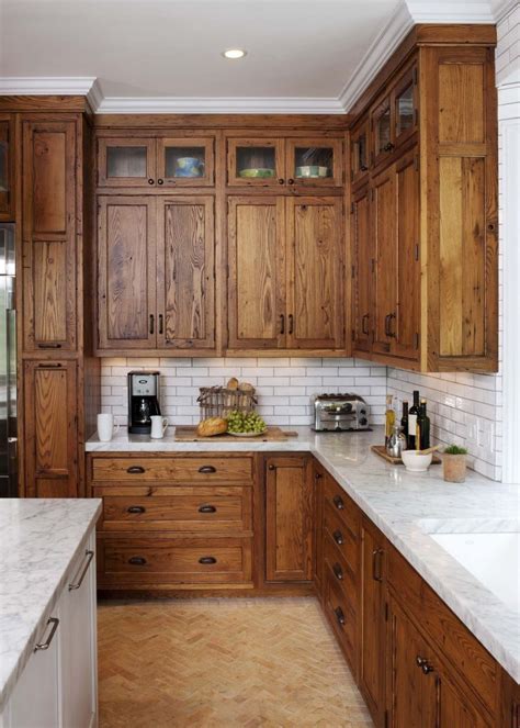 1950s knotty pine kitchen updated with solid surface white countertops and subway tile backsplash cabinets. 25 Elegant Knotty Pine Kitchen Cabinets in 2020 | Stained ...