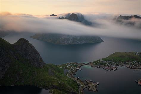 Sea Fog Rolls Though Fjords And Over Mountain Peaks From Summit Of