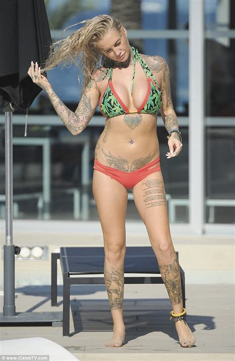 Jemma Lucy Flaunts Her Ample Assets And Tattoos In Tiny Print Bikini In