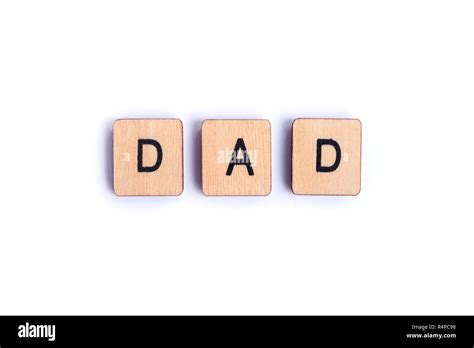 The Word Dad Spelt With Wooden Letter Tiles Stock Photo Alamy