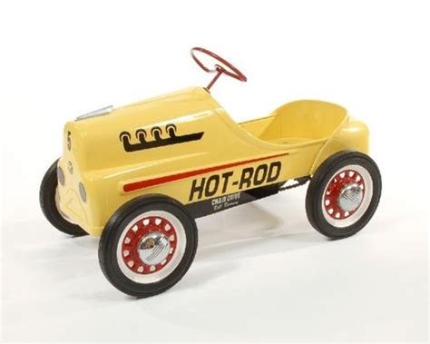 A Yellow Toy Car Sitting On Top Of A White Floor
