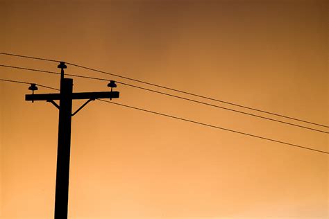 A Telephone Pole At Sunset Photograph By Pete Ryan