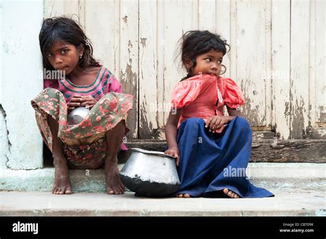 Poor Indian Nomadic Beggar Girls Sitting On An Indian Street Begging