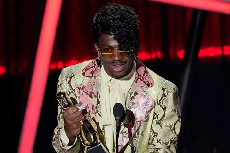 Lil nas x reveals he once worried coming out would 'overshadow' his career. Lil Nas X Wears a Snakeskin Suit at the Billboard Music Awards 2020 - Footwear News