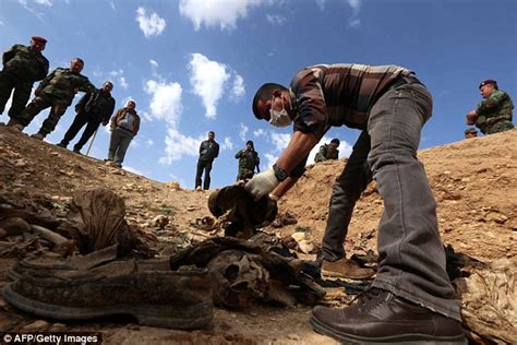 yazidis sift through mass grave trying to identify loved ones they fear were killed by isis