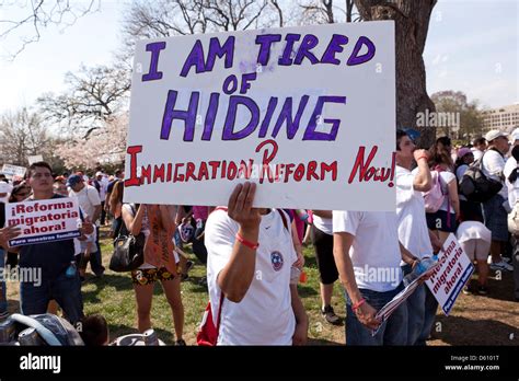 Man Holding Placard At Immigration Reform Rally Washington Dc Usa