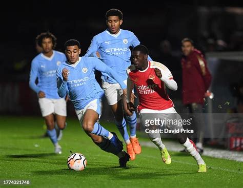 Charles Sagoe Jr Of Arsenal Takes On Ezra Carrington Of Man City