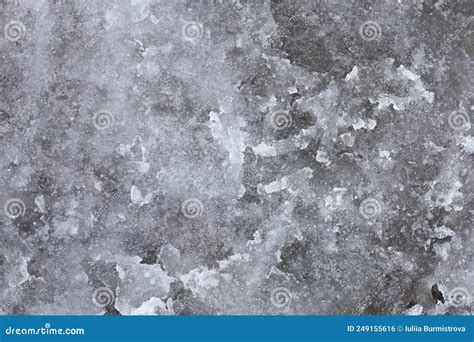 Abstract Background With Snow Slush Outside On Street Road Caused By
