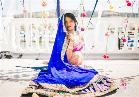 An Indian Maternity Photo Shoot With Glitters Bridal Jewellery And