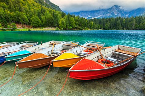 Stunning Alpine Landscape And Colorful Boatslake Fusineitalyeurope