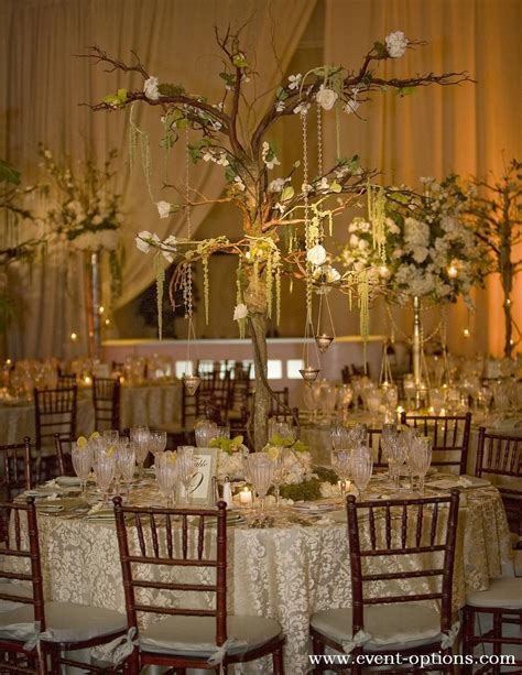 Tree Branch Centerpiece With Delicate Flowers For An