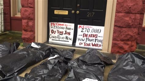 Activists Looking For Relief Package Pile Up Body Bags Outside Homes Of