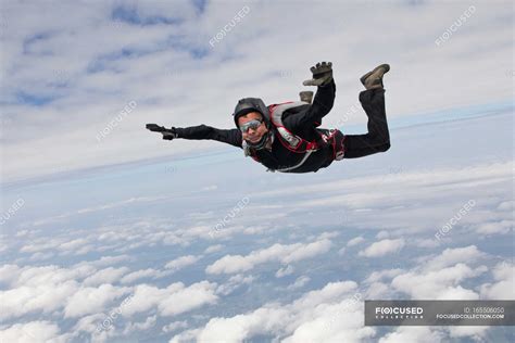 Skydiver Flying In The Sky With Clouds — Bavaria Person Stock Photo