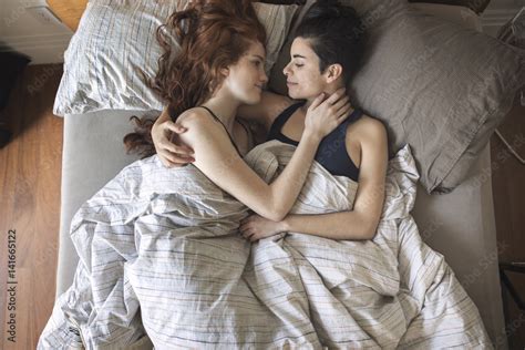 Overhead View Of Couple Looking At Each Other On Bed Photos Adobe Stock