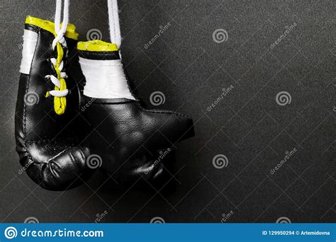 Two Hanging Black Boxing Gloves On Black Background Stock Photo Image