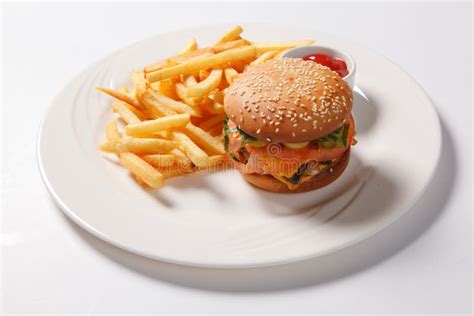 Fast Food Hamburger And French Fries On A White Plate Stock Image
