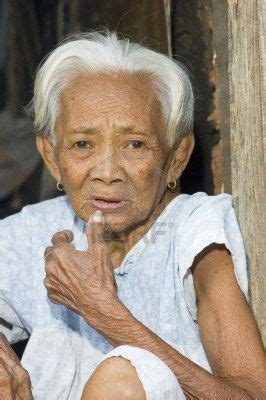 PHILIPPINES Old Filipino Woman Stares Blankly In A Slum Area In