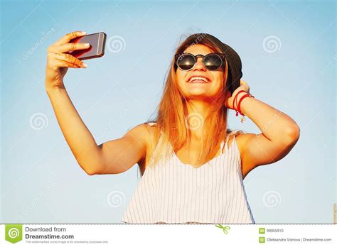 Portrait Of A Beautiful Young Woman Making Selfie On Smart Phone Stock
