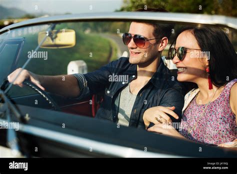 Couple Driving A Car Traveling On Road Trip Together Stock Photo Alamy