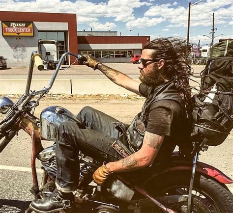 A Photo Of A Long Hair Male On A Harley Davidson Old Motorcycle Touring