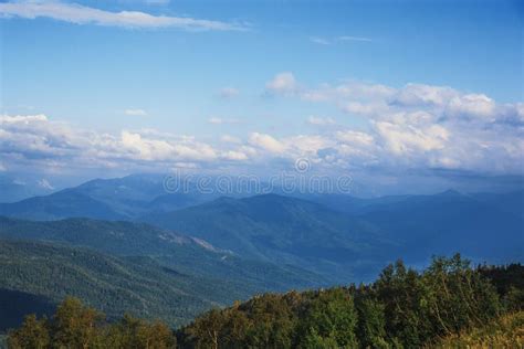 Majestic Mountains Landscape Panorama Bright Blue Sky With Fluffy