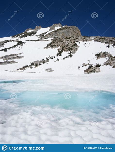 North Peak Above Melting Snowy Lake Stock Image Image Of Wilderness