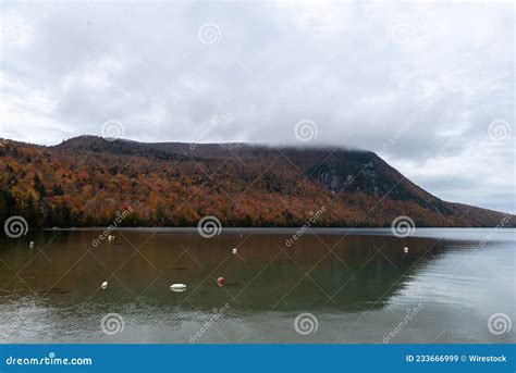 View Of A Green Autumn Mountain Reflecting On The Lake Willoughby