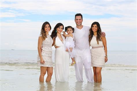 White will showcase your faces more than your clothing and it looks great on our light sand. Beach Family Portraits Playa del Carmen - Rashan and Aric