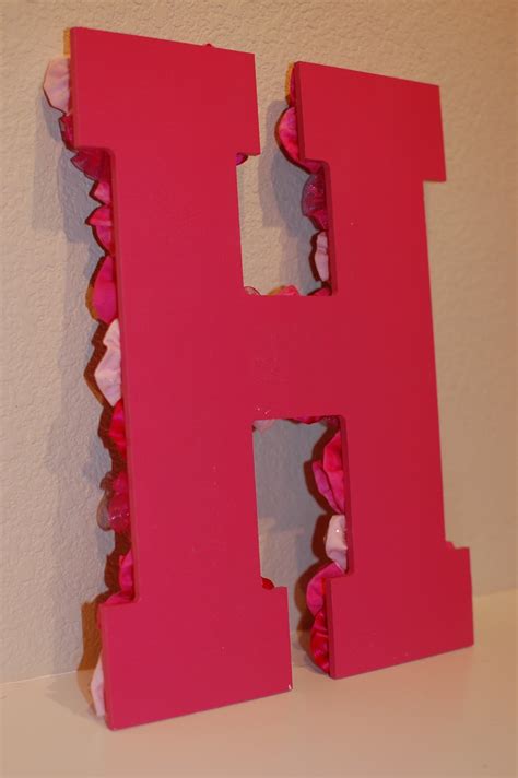 Turn picture black and white, draw grid on print out, draw grid on larger paper, draw picture, paint with black. Pinkie for Pink: DIY Letter Wall Decor