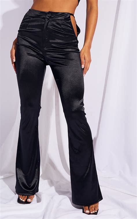 Black Stretch Satin Cut Out Hip Flared Trousers Prettylittlething