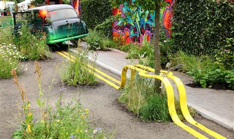 Yellow Street Lines Form A Park Bench Around A Tree In This Temporary