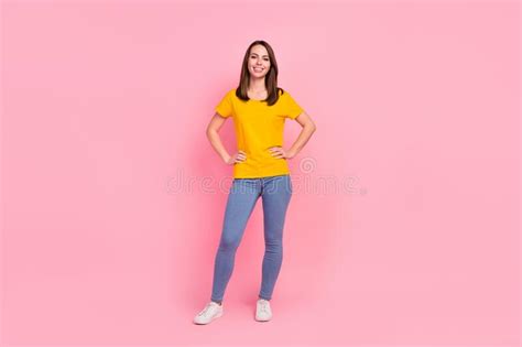 Full Size Photo Of Nice Brunette Hair Millennial Lady Stand Wear Yellow T Shirt Jeans Isolated