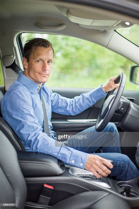 Portrait Of Confident Man Sitting In Car High Res Stock Photo Getty