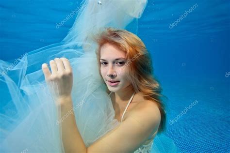Beautiful Girl In White Wedding Dress Posing Underwater Portrait Close Up Horizontal