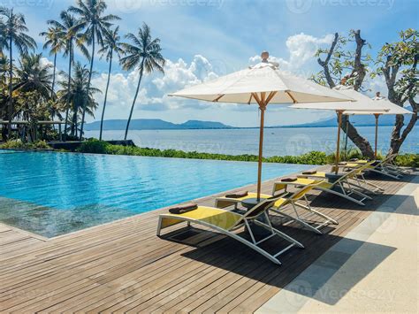 Beautiful Tropical Swimming Pool In Hotel Or Resort With Umbrella