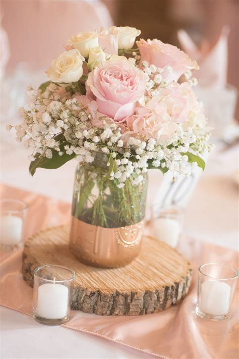 Rose and hydrangea centerpiece with painted mason jar and wood round