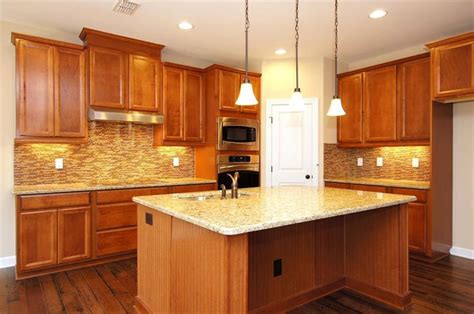 Maple Cognac Wood Kitchen Cabinets With Wood Looking Tile Flooring