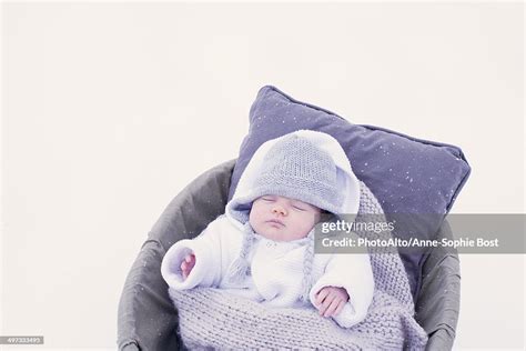 Baby Sleeping In Bassinet In Snow High Res Stock Photo Getty Images