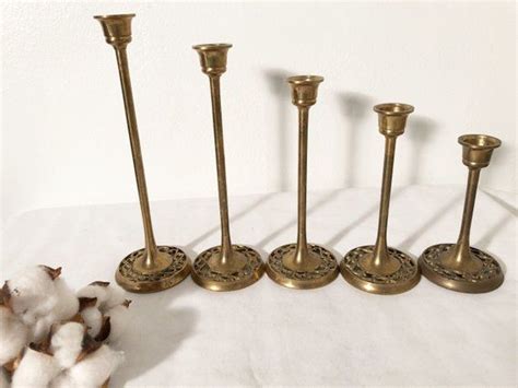 Set Of 5 Brass Candlestick Holders The Bases Have A Beautiful Design